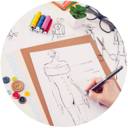 The designer is hand-drawing the clothing draft