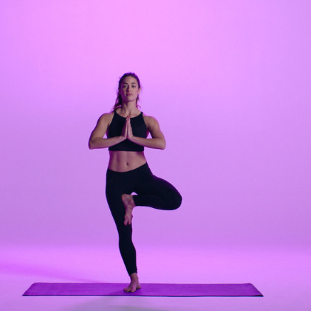 A person performing a yoga pose that enhances strength and flexibility, showcasing the benefits of regular yoga practice